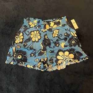 Blue flowy shorts with white and navy florals, Breathable material high waisted.